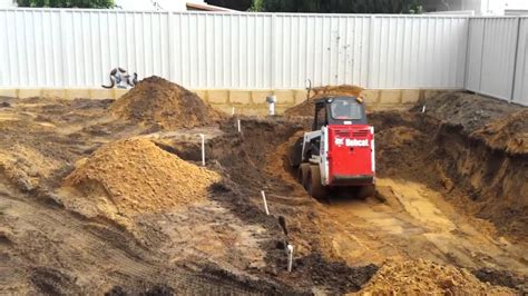 digging pool with skid steer|digging a pool with a mini.